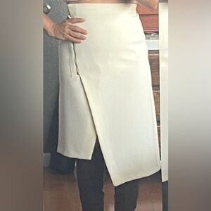 Beautiful, cream colored asymmetrical skirt.